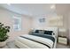 Bright bedroom showcases neutral walls and carpet with a window for natural light at 2065 Depew St, Edgewater, CO 80214