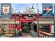Festive beer garden with ample seating and vibrant signage at 2065 Depew St, Edgewater, CO 80214