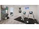 Basement exercise room with modern equipment and doorway to bedroom at 2065 Depew St, Edgewater, CO 80214