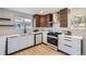 Well-appointed kitchen with stainless steel appliances, modern cabinetry, and hardwood flooring for a sophisticated design at 2065 Depew St, Edgewater, CO 80214