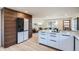 Open-concept kitchen featuring a large center island, state-of-the-art appliances, and access to the living area at 2065 Depew St, Edgewater, CO 80214
