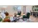 Inviting living room with hardwood floors, stylish furniture, and abundant natural light from the large front window at 2065 Depew St, Edgewater, CO 80214