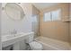 Bathroom with bathtub, tiled wall, and a modern vanity at 7460 Krameria Dr, Commerce City, CO 80022