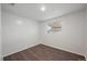 Cozy bedroom featuring updated flooring and a window at 7460 Krameria Dr, Commerce City, CO 80022