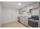 Well-lit kitchen with updated appliances, modern countertops and ample cabinet space at 7460 Krameria Dr, Commerce City, CO 80022