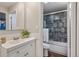 Neutral toned bathroom features a glass enclosed shower and floating sink at 937 Clarkson St # 101, Denver, CO 80218