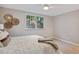 A corner view of a bedroom features a bright window, stylish accents, and ceiling fan at 937 Clarkson St # 101, Denver, CO 80218