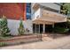 Inviting building entrance with modern architecture and landscaping at 937 Clarkson St # 101, Denver, CO 80218