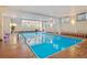 Indoor swimming pool with clear blue water and surrounding brick at 937 Clarkson St # 101, Denver, CO 80218