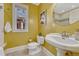 Bright bathroom with tile floor, modern fixtures, and framed mirror at 1716 S Ogden St, Denver, CO 80210