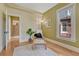 Cozy bedroom with a comfortable chair, natural light, and wood floors at 1716 S Ogden St, Denver, CO 80210
