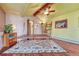 Bonus room with peaked ceilings, ceiling fan, decorative rug, and exposed wood ceiling beams at 1716 S Ogden St, Denver, CO 80210