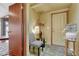 Entryway featuring tile flooring, modern chair and decor, and access to additional rooms at 1716 S Ogden St, Denver, CO 80210