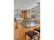 Kitchen features stainless appliances, granite countertops, and wood cabinets at 1716 S Ogden St, Denver, CO 80210