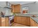 Kitchen features stainless appliances, granite countertops, and custom cabinets at 1716 S Ogden St, Denver, CO 80210