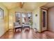 Bright living room with hardwood floors, seating area by large windows and neutral color scheme at 1716 S Ogden St, Denver, CO 80210