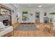 Bright living room with hardwood floors, fireplace, natural light, and comfortable seating at 1716 S Ogden St, Denver, CO 80210