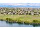 Picturesque aerial view of houses and a lake, highlighting the natural surroundings at 26741 E Arbor Dr, Aurora, CO 80016