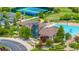 Aerial view showcasing the community clubhouse, swimming pool, and tennis courts at 26741 E Arbor Dr, Aurora, CO 80016