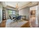 Elegant dining room with tray ceiling, chandelier, and lots of light at 26741 E Arbor Dr, Aurora, CO 80016