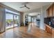 Open layout with hardwood floors and access to the kitchen and outdoor deck at 26741 E Arbor Dr, Aurora, CO 80016