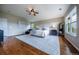 Spacious main bedroom boasts hardwood floors, ceiling fan and large windows for ample natural light at 26741 E Arbor Dr, Aurora, CO 80016