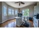Bright office with multiple windows, hardwood floors, and desk at 26741 E Arbor Dr, Aurora, CO 80016