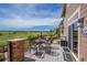Open air deck with chairs and an outdoor seating area with a view at 26741 E Arbor Dr, Aurora, CO 80016