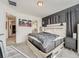 Bright bedroom with a spacious bed and a glimpse of the attached bathroom at 17991 E 103Rd Ave, Commerce City, CO 80022