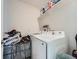 Well-equipped laundry room with modern machines, storage shelving, and tidy organization at 17991 E 103Rd Ave, Commerce City, CO 80022