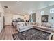 Bright living room featuring a cozy sectional sofa and stylish patterned rug at 17991 E 103Rd Ave, Commerce City, CO 80022