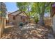 Backyard with stone bench, built-in grill, a pergola, and a detached garage at 1601 Albion St, Denver, CO 80220