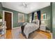 Cozy bedroom with hardwood floors and large window with reading nook at 1601 Albion St, Denver, CO 80220