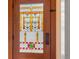Close up of the front door with decorative glass panel at 1601 Albion St, Denver, CO 80220