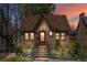 Charming brick home with a cozy front porch and landscaped yard, perfect for enjoying peaceful evenings at 1601 Albion St, Denver, CO 80220