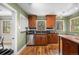 Bright kitchen featuring stainless appliances, black subway tile backsplash and hardwood floors at 1601 Albion St, Denver, CO 80220