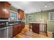 Charming kitchen boasts hardwood floors, stainless appliances and a breakfast island at 1601 Albion St, Denver, CO 80220