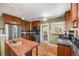 Updated kitchen with stainless appliances, granite countertops, subway tile, and pass-through window at 1601 Albion St, Denver, CO 80220