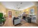 Comfortable living room with a fireplace, ceiling fan, and ample natural light, creating a warm and welcoming atmosphere at 1601 Albion St, Denver, CO 80220