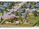 Aerial view of a neighborhood showcasing homes with well-kept yards, mature trees, and visible play equipment at 4804 Eckert St, Castle Rock, CO 80104