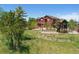 Large backyard featuring a playset, patio, and ample space for recreation at 4804 Eckert St, Castle Rock, CO 80104