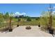 Beautiful backyard featuring a cozy fire pit, lush green lawn, and manicured landscaping at 4804 Eckert St, Castle Rock, CO 80104