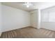 Simple bedroom features neutral carpeting, a ceiling fan, and a double door closet at 4804 Eckert St, Castle Rock, CO 80104