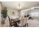 Formal dining room with decorative lighting, arched doorway, and a large window at 4804 Eckert St, Castle Rock, CO 80104