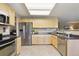 Functional kitchen with stainless steel refrigerator and light wood cabinetry at 4804 Eckert St, Castle Rock, CO 80104
