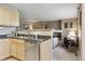 Open kitchen with stainless steel appliances and view of the living room at 4804 Eckert St, Castle Rock, CO 80104