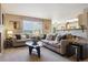 Comfortable living room with neutral color scheme with an open view to the kitchen at 4804 Eckert St, Castle Rock, CO 80104