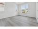 Inviting bedroom with large windows offering ample natural light and neutral gray toned flooring at 25273 E Warren Pl, Aurora, CO 80018