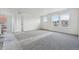 Spacious bedroom boasts large windows and neutral carpeting at 25273 E Warren Pl, Aurora, CO 80018