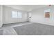 Bright bedroom features multiple windows and neutral carpeting at 25273 E Warren Pl, Aurora, CO 80018